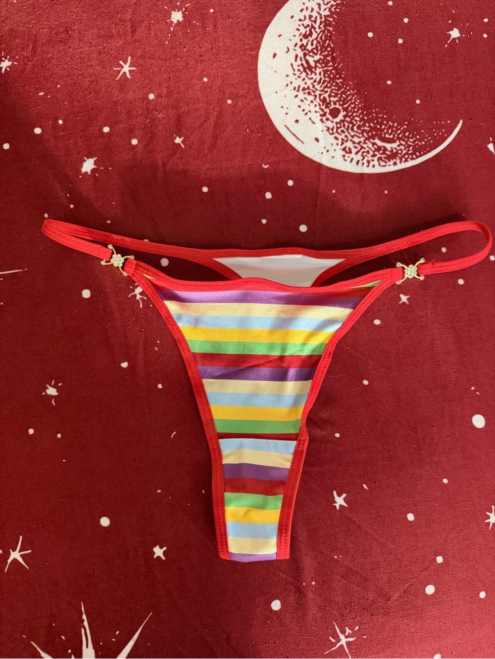 Sexy and chic vibrant metal decorated striped thong, size M